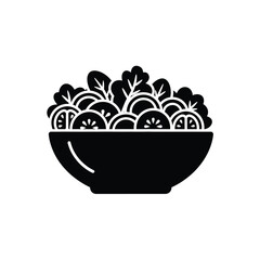 Black bowl filled with sliced kiwis and leaves on white background