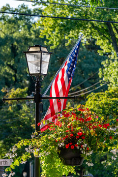 American flag and lamp post on corner.