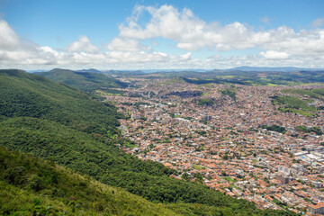 Naklejka premium wide aerial view over city of Pocos de Caldas, Minas Gerais, Brazil. and mountain landscape