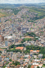 Fototapeta premium wide aerial view over city of Pocos de Caldas, Minas Gerais, Brazil. and mountain landscape