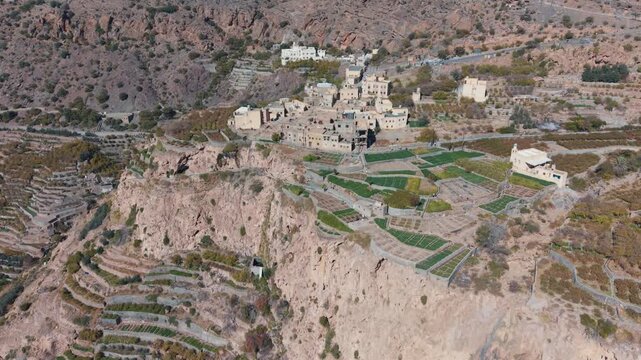 Aerial view of traditional terraced farms with falaj irrigation in Al Shuraijah, Oman