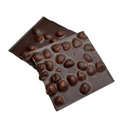 Broken dark chocolate bar with roasted hazelnuts
