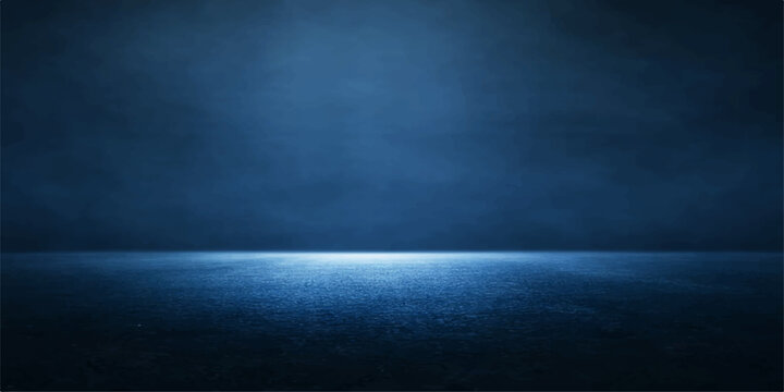 Dark blue grunge wall background with a subtle spotlight shining through mystical smoke and fog texture to create a vintage night sky design