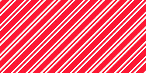 Red and pink Christmas seamless pattern. Candy cane diagonal stripes background. Repeating decoration wallpaper. Winter holidays lines backdrop. Xmas peppermint present wrapping print design. Vector