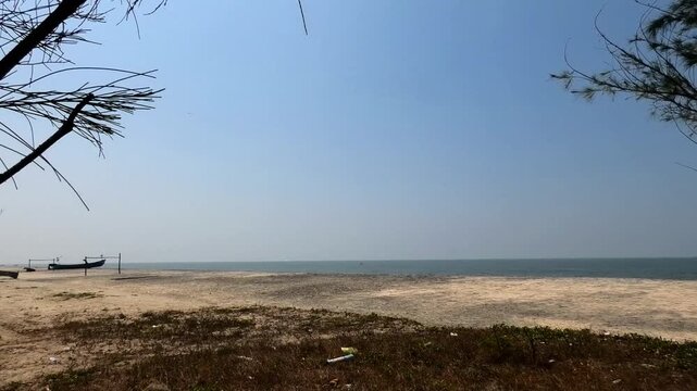 The beautiful beach at Punnapra, Alappuzha, Kerala, India with densely covered whistling pine trees