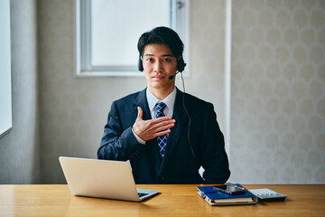 Confident businessman with hand on chest expressing trust and reassurance to a client