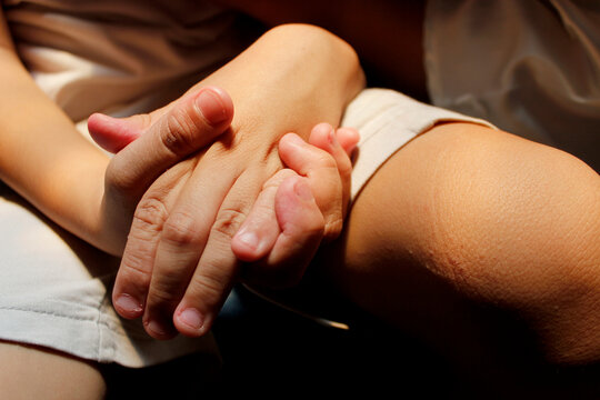 special needs child holding hands