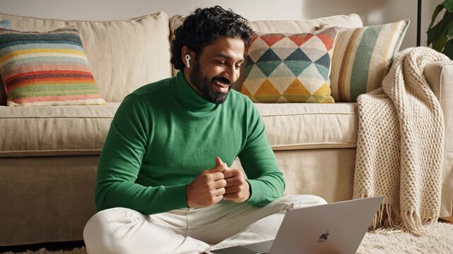 Man using laptop on sofa