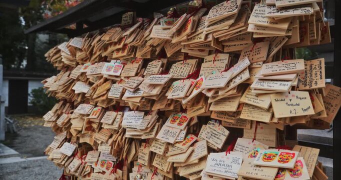 Wooden talismans on wall - closeup, steady cam shot