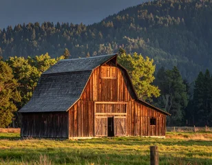 Poster de jardin  Rustic Barn in Grand Teton National Park at Sunset.  © isrofil
