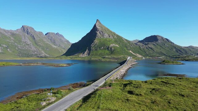 Aerial view of the Fredvang Bridges with the striking peak of Volandstind in the background. Fredvang in the Lofoten Islands in Norway.