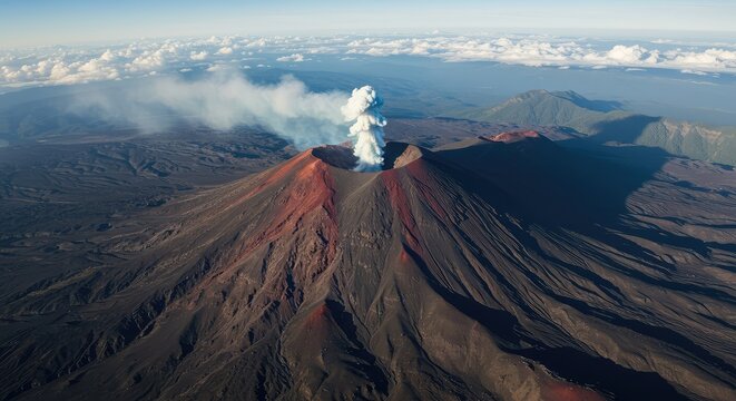 Dramatic aerial view of a massive stratovolcano with smoke billowing from its central caldera, surrounded by harsh, dark volcanic rock and ash fields ,smoke ,magma ,plume