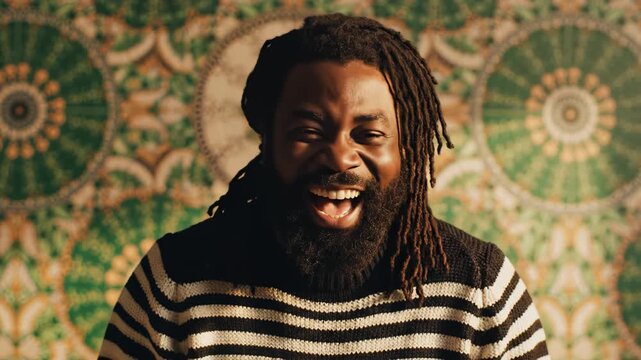 Man with dreadlocks smiling