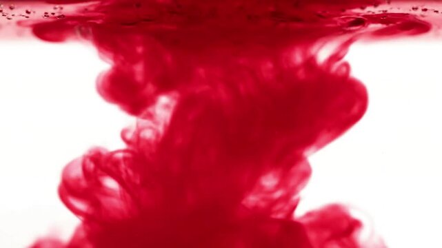 Ethereal Liquid Patterns Detailed shot of vibrant ink plumes diffusing and forming mesmerizing, organic patterns, illuminated from behind.