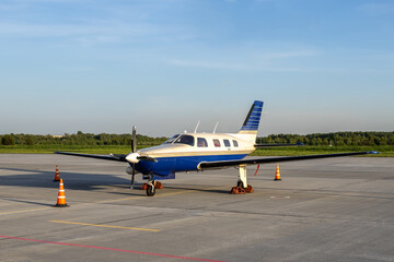 Private turboprop plane at the airport in the evening
