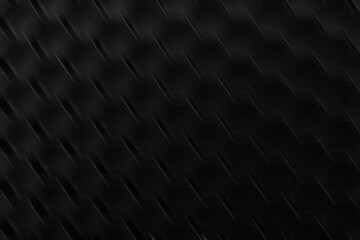 Close up view of a textured surface showing a pattern of hexagons in dark colors with slight light reflections captured at night