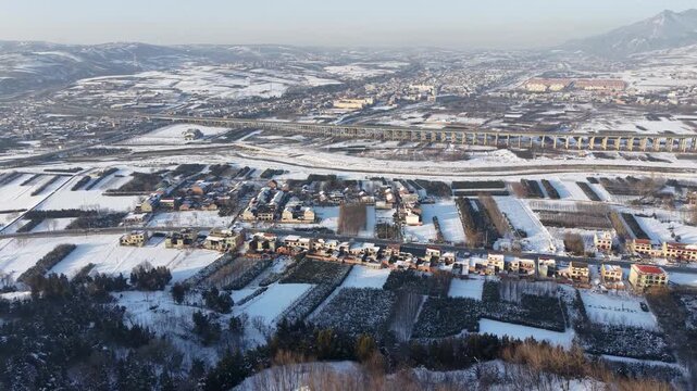 Snowy Valley with Highway Bridge and Mountain Landscape