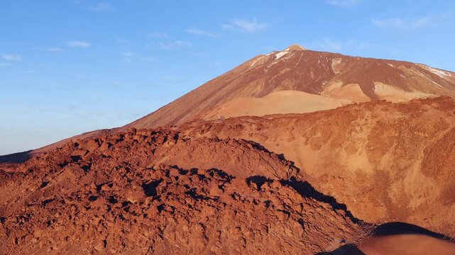 Cinematic aerial sunrise above the sea of clouds and Mount Teide peak in Tenerife Canary Islands
