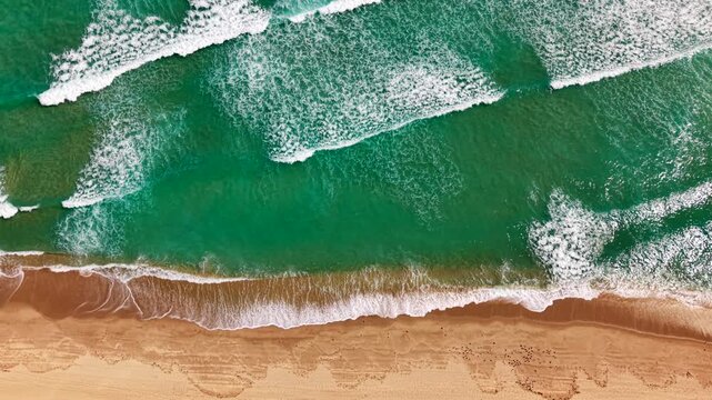 Aerial reverse clip waves crashing 4k