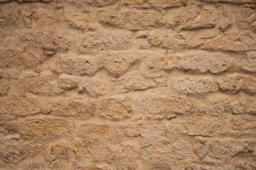 Old stone wall texture background showing natural rock masonry © Jelena