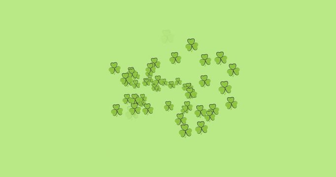 Digital animation of multiple clover leaves forming against green background