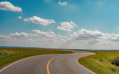 Winding rural road under a vibrant blue sky.
