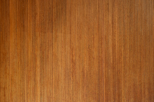 Warm brown wood grain paneling textured background