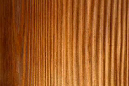 Wood panel displaying vertical ribbed texture and grain