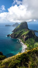 Fototapeta premium Lush green island with steep cliffs meets the bright blue ocean, under a sunny sky filled with fluffy white clouds
