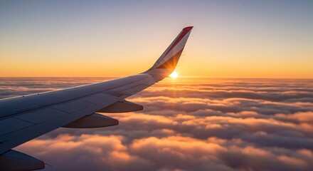 Obraz premium Breathtaking Airplane Wing Above Clouds at Sunrise, Showcasing Nature s Beauty and Tranquility