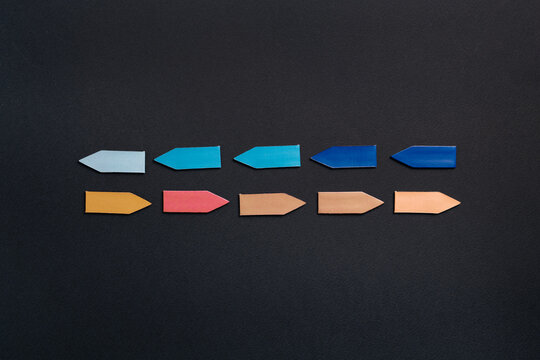 Colorful arrows aligned in parallel rows representing direction strategy leadership and business growth concept