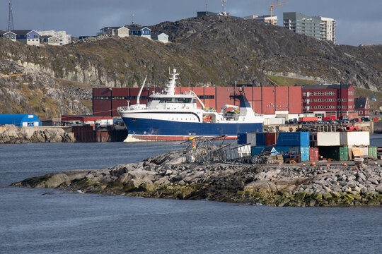 Nuuk, Greenland, September 2025, Closeup of Industry and Business Along the Shore of the Nuuk Fjord, with Housing in the Hills