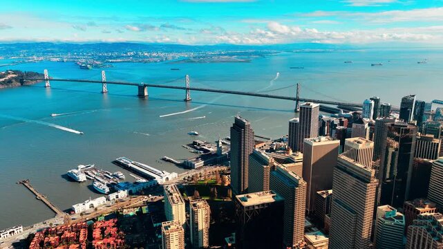 Aerial view of Oakland Bay Bridge from downtown San Francisco. Bay with ships. Wide panorama of the city
