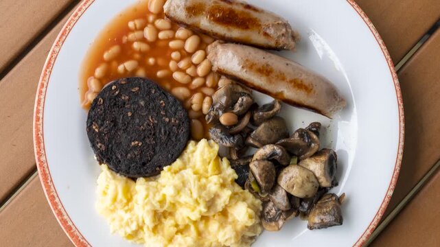 Rotating English Breakfast of Beans Eggs, Mushrooms and Black Pudding