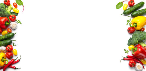 Fresh healthy vegetables creating a decorative border on white