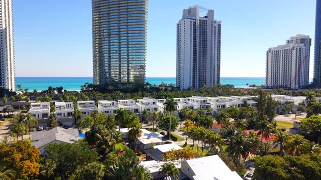 Drone Sunny Isles Beach aerial 2026. Luxury homes and highrise condominiums on the beach