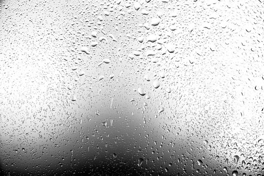 Realistic water droplets on the transparent window.