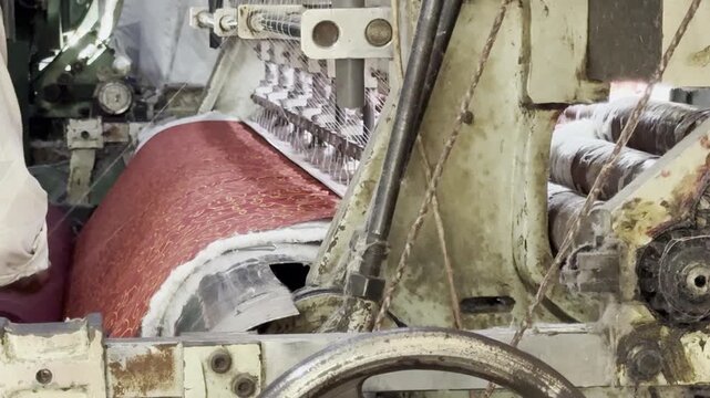 Dharavi, Mumbai, India &ndash; January 29, 2026: Close view of blanket quilting on heavy textile machinery in a neighborhood manufacturing environment.