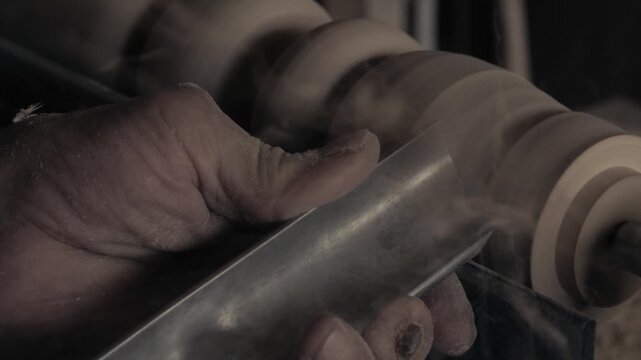 a master carpenter working with wood in his workshop (original sound track) 