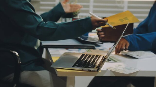 Business leaders discuss implement environmental sustainability strategies net zero carbon goals corporate responsibility using ESG reports data at meeting