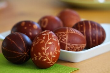 Naklejka na ściany i meble Polish Easter tradition. Pisanki eggs dyed with onion shells with scratched patterns.