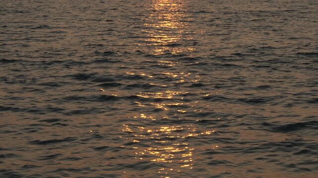 Golden Sun Path Shimmering on Ocean Waves at Sunset, Peaceful Seascape with Reflections, Cinematic Nature and Travel Background Video