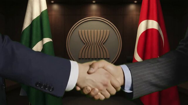 Diplomatic handshake signifies partnership agreement between representatives of Pakistan and Turkey under ASEAN emblem