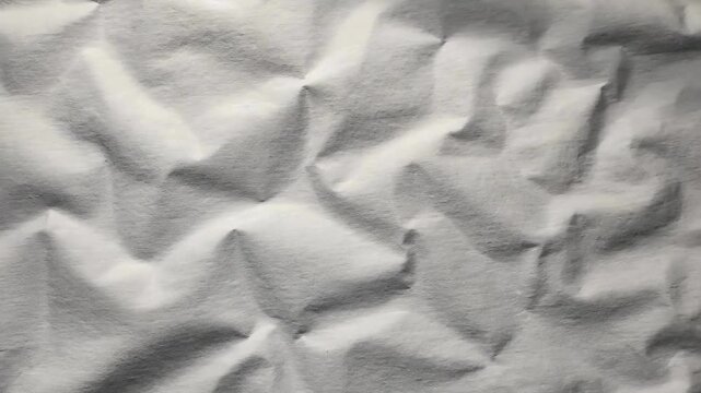 A video showcasing a close-up view of a mattress with a shadow cast on it