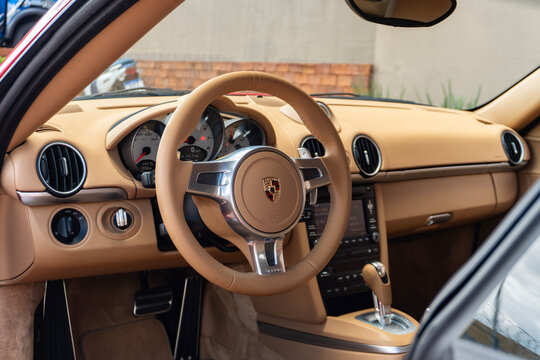 Porsche Cayman S Beige leather steering wheel and dashboard, Luxury sports car cockpit interior