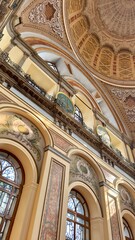 Fototapeta premium Interior of Dolmabahce Mosque in Istanbul during Ramadan. Elegant marble minbar and arched windows in Ottoman Baroque style. Peaceful spiritual atmosphere for Islamic prayer in the holy month.