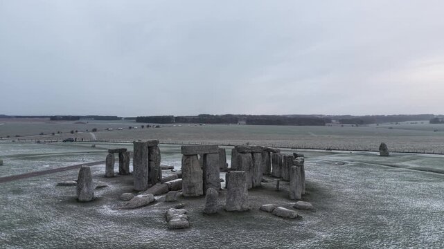 A drone view of snow-covered Stonehenge and the Wiltshire countryside in England, UK. The stone circle dates back to 3000 BC and is one of the most famous ancient wonders of the world and a UNESCO
