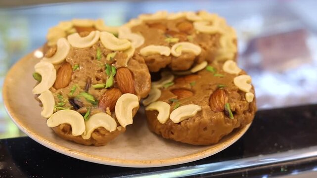 Sohan halwa a dessert garnished with dry fruits