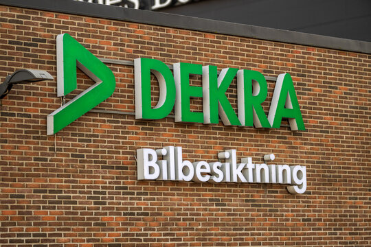 Gothenburg, Sweden - March 09 2025: Close-up of DEKRA signage on brick wall.