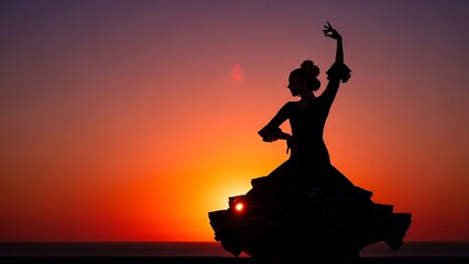 Silhouette of woman dancing at sunset.